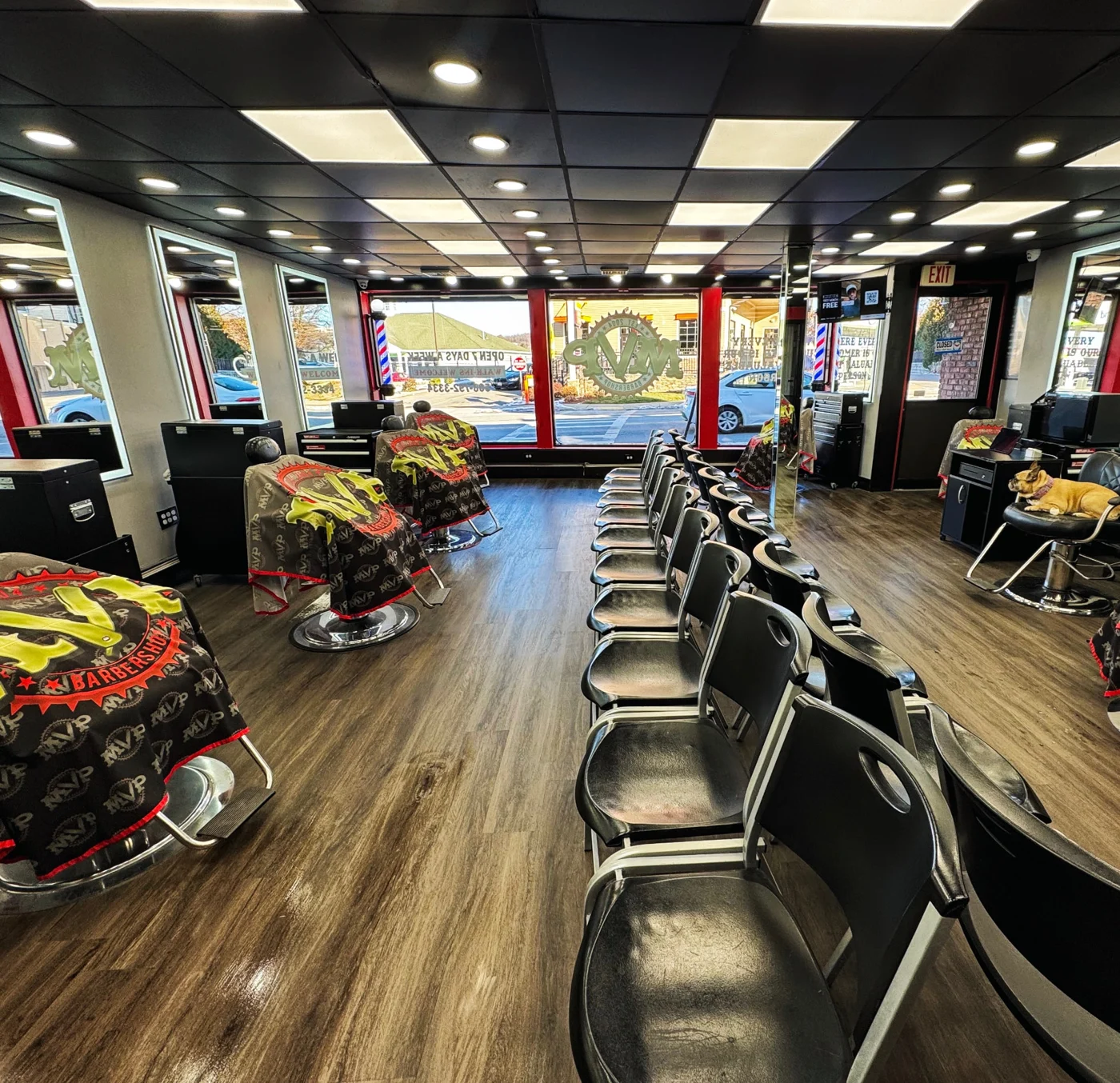 Inside MVP Barbershop, with barber stations and customer seating