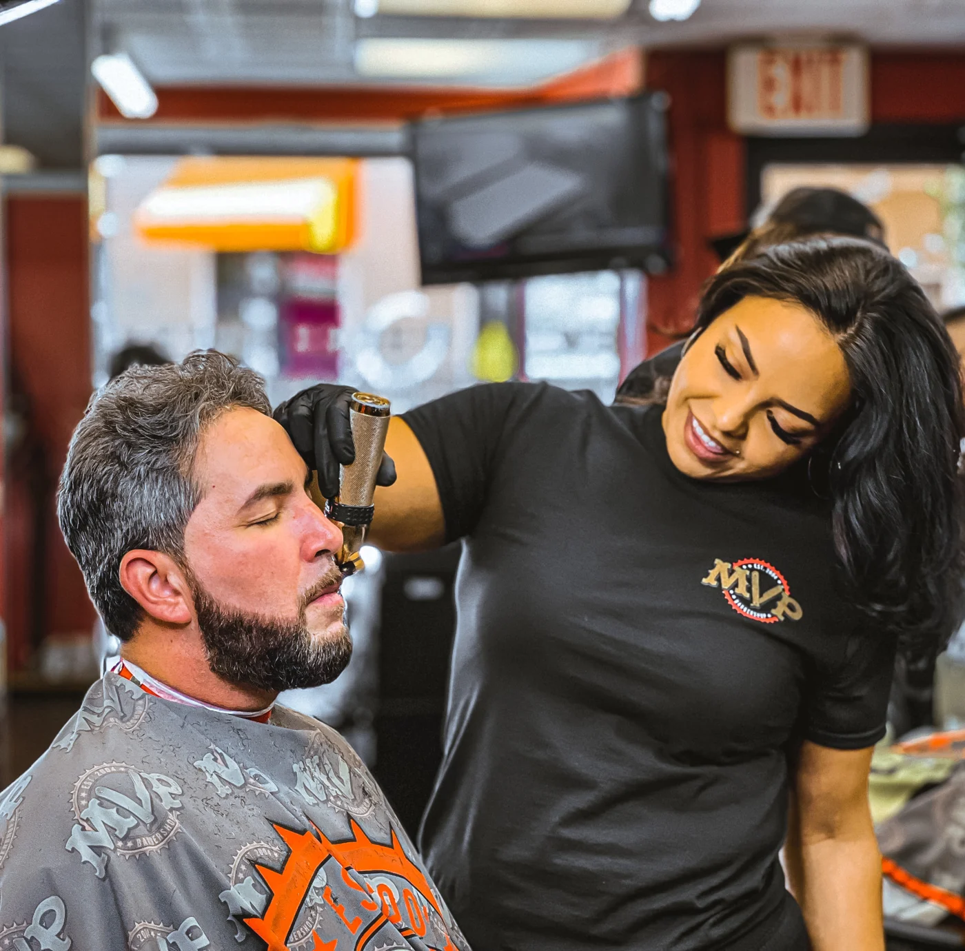 MVP team member grooming a customer's beard
